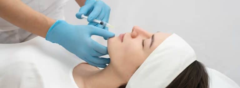 Blog 1 An aesthetician performing an injection demonstration as part of CAMA's medical aesthetics training courses